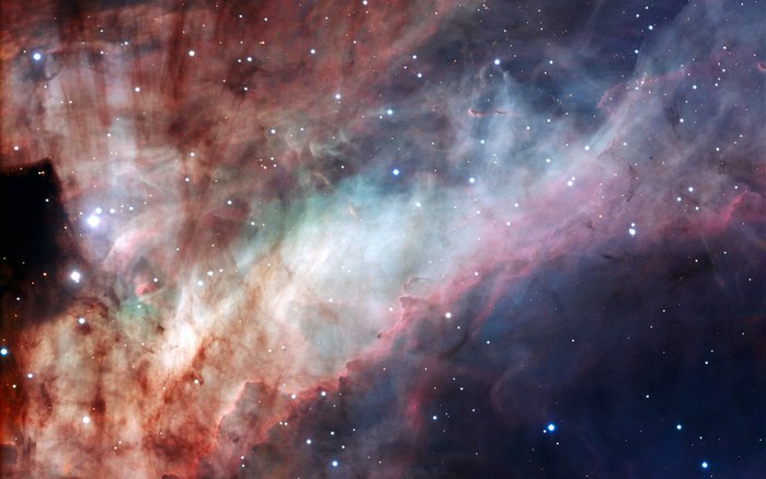 Туманность Омега (также известная как туманность Лебедь, Подкова, Лобстер, M 17 и NGC 6618) является областью H II в созвездии Стрельца. Фото ESA (700x437, 56Kb)