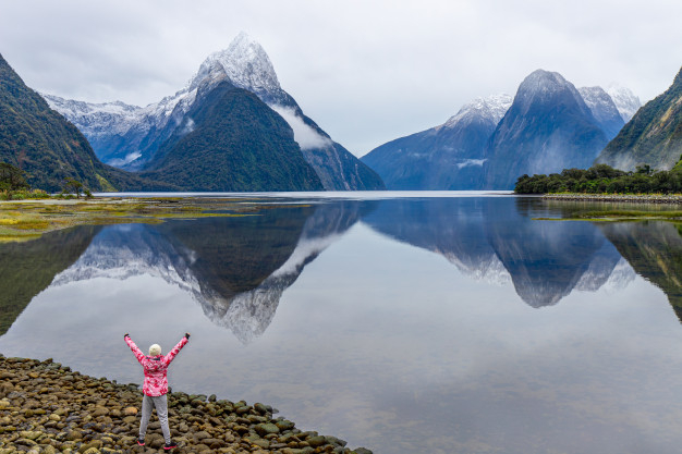 young-asian-traveler-celebrating-success-at-milford-sound-fiordland-national-park-south-island-new-zealand_56199-102 (626x417, 207Kb)