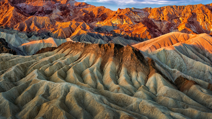 Eroded mountain ridges in the sunset at Zabriskie Point, Death Valley, California, USA (700x393, 436Kb)