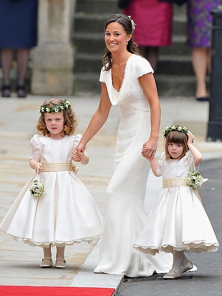 LONDON, ENGLAND - APRIL 29:  Sister of the bride and Maid of Honour Pippa Middleton holds hands with Grace Van Cutsem and Eliza Lopes as they arrive to attend the Royal Wedding of Prince William to Catherine Middleton at Westminster Abbey on April 29, 201