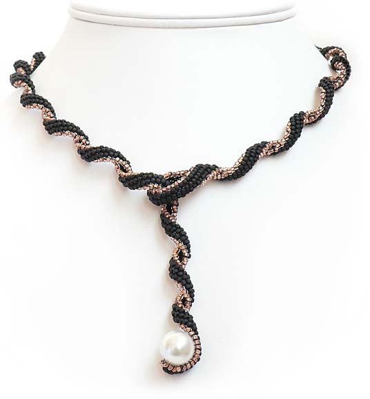 Single-Strand Necklace with Seed Beads and a Pearl.