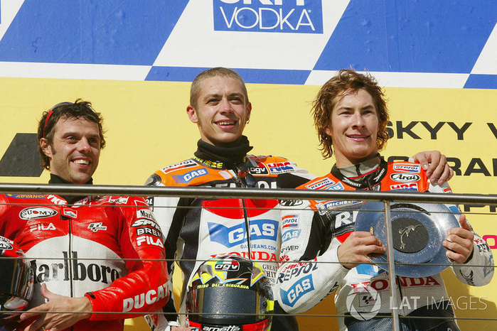 motogp-australian-gp-2003-podium-race-winner-valentino-rossi-repsol-honda-team-second-plac (700x466, 485Kb)