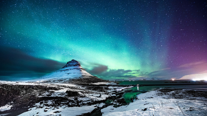 Northern lights at Mount Kirkjufell with a man passing by, Iceland (700x393, 351Kb)