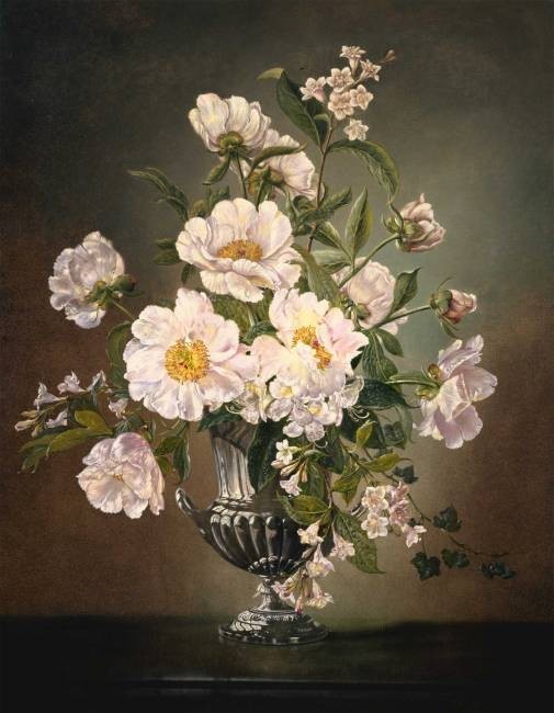 Flowers in a silver pedestal vase